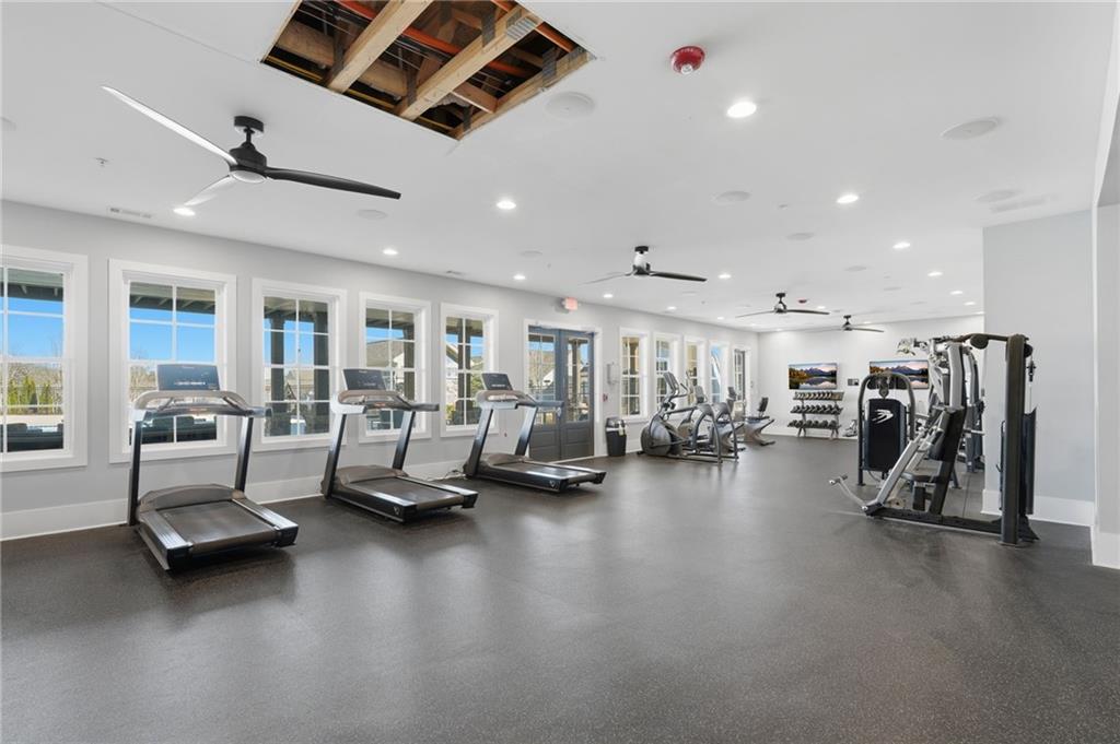 1413 Bluffs Ridge Way Canton, GA 30114 - Photo 54 of 62 a view of a room with gym equipment