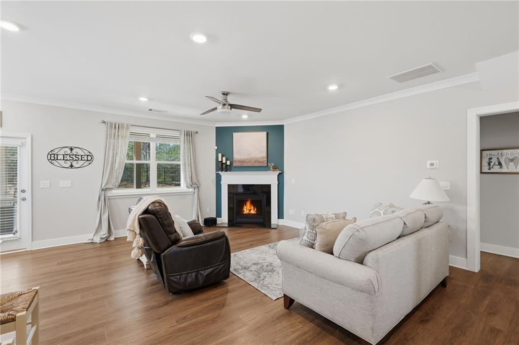 1413 Bluffs Ridge Way Canton, GA 30114 - Photo 7 of 62 a living room with furniture and a fireplace