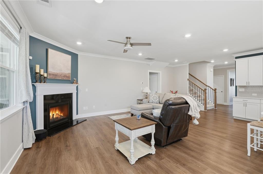 1413 Bluffs Ridge Way Canton, GA 30114 - Photo 8 of 62 a living room with furniture and a fireplace