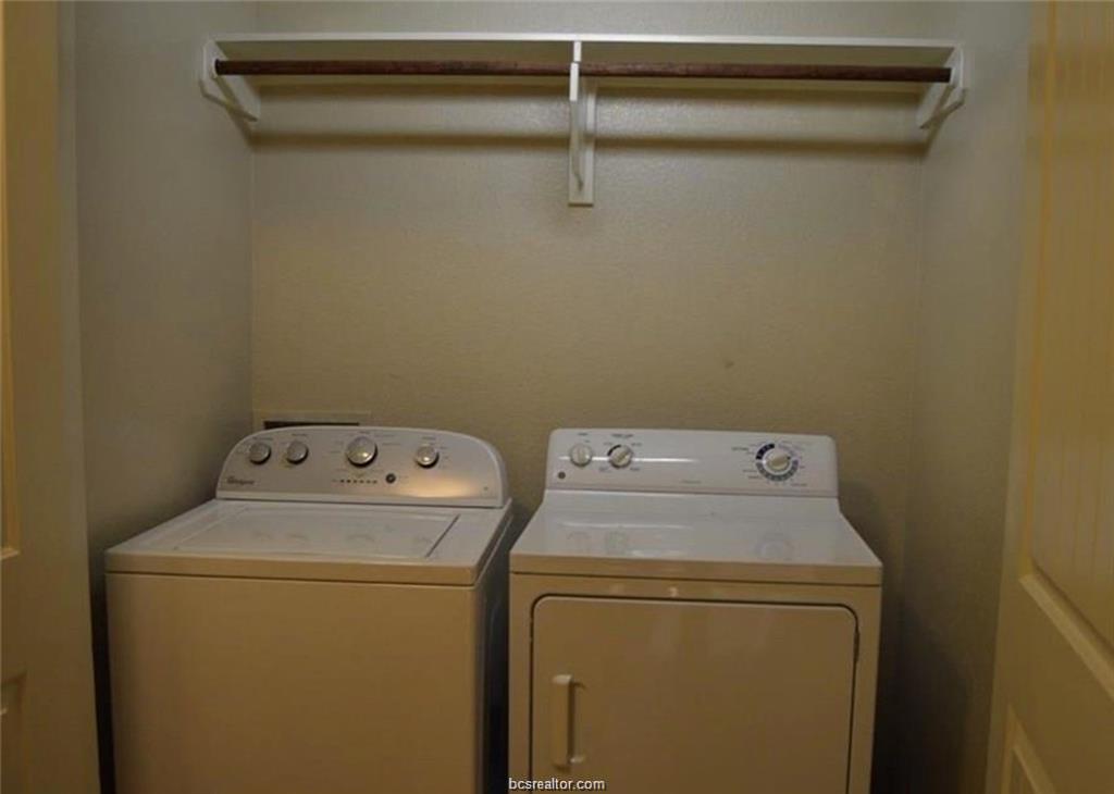 4309 Old College Road Bryan, TX 77801 - Photo 4 of 9 a utility room with dryer and washer