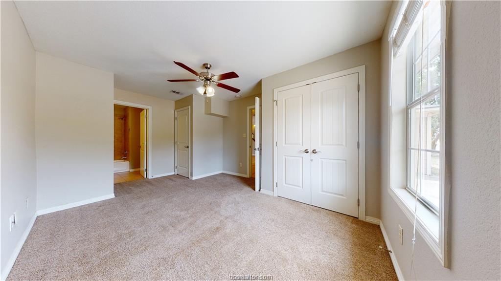 4309 Old College Road Bryan, TX 77801 - Photo 9 of 9 a view of a hallway with a ceiling fan
