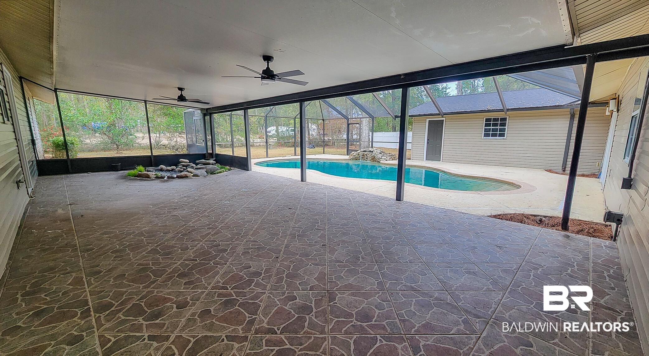 22711 Highway 98 Foley, AL 36535 - Photo 49 of 74 Swimming pool with a sunroom, a lanai, and a patio area
