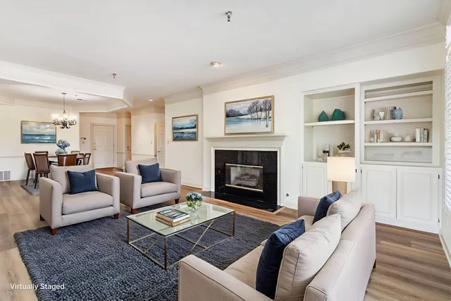 a view of empty room with cabinet and fireplace