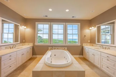a bathroom with a bathtub and a sink