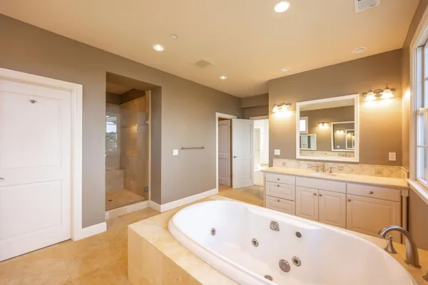 a view of a room with a walk in closet and wooden floor