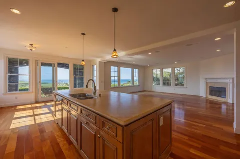 a kitchen with sink and windows