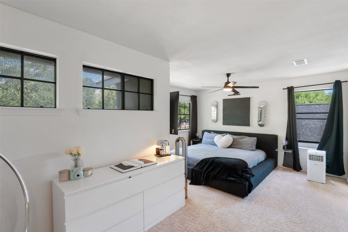 9833 Briar Ridge Drive Austin, TX 78748 - Photo 12 of 29 a bedroom with a bed window and wall painting