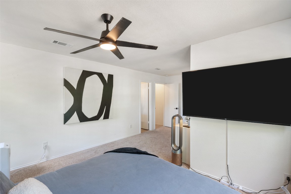 9833 Briar Ridge Drive Austin, TX 78748 - Photo 14 of 29 a floor to ceiling window and a flat screen tv