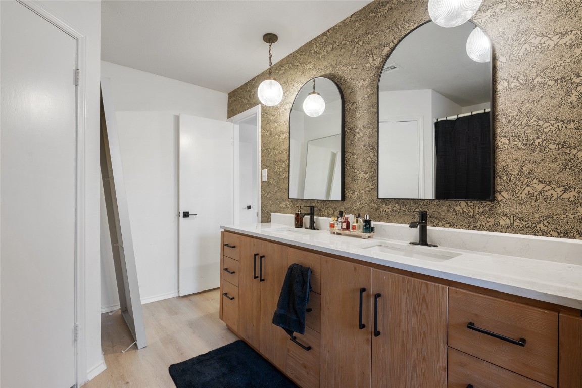 9833 Briar Ridge Drive Austin, TX 78748 - Photo 17 of 29 a bathroom with a double vanity sink and mirror