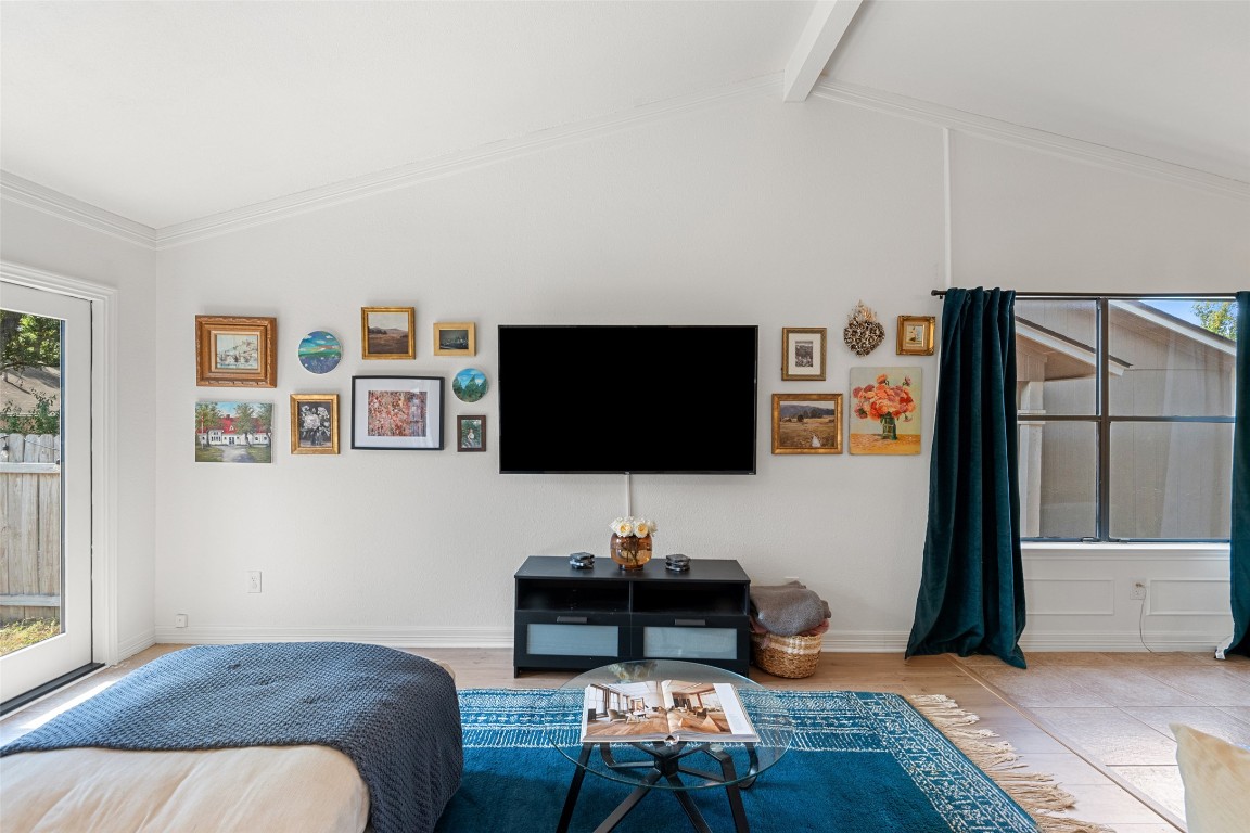 9833 Briar Ridge Drive Austin, TX 78748 - Photo 5 of 29 a bedroom with a bed and a flat screen tv