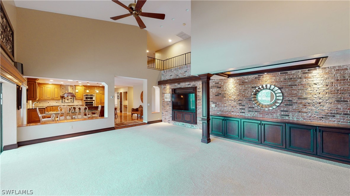 14565 Eagle Ridge Drive Fort Myers, FL 33912 - Photo 14 of 28 a view of an empty room with a fireplace and a window