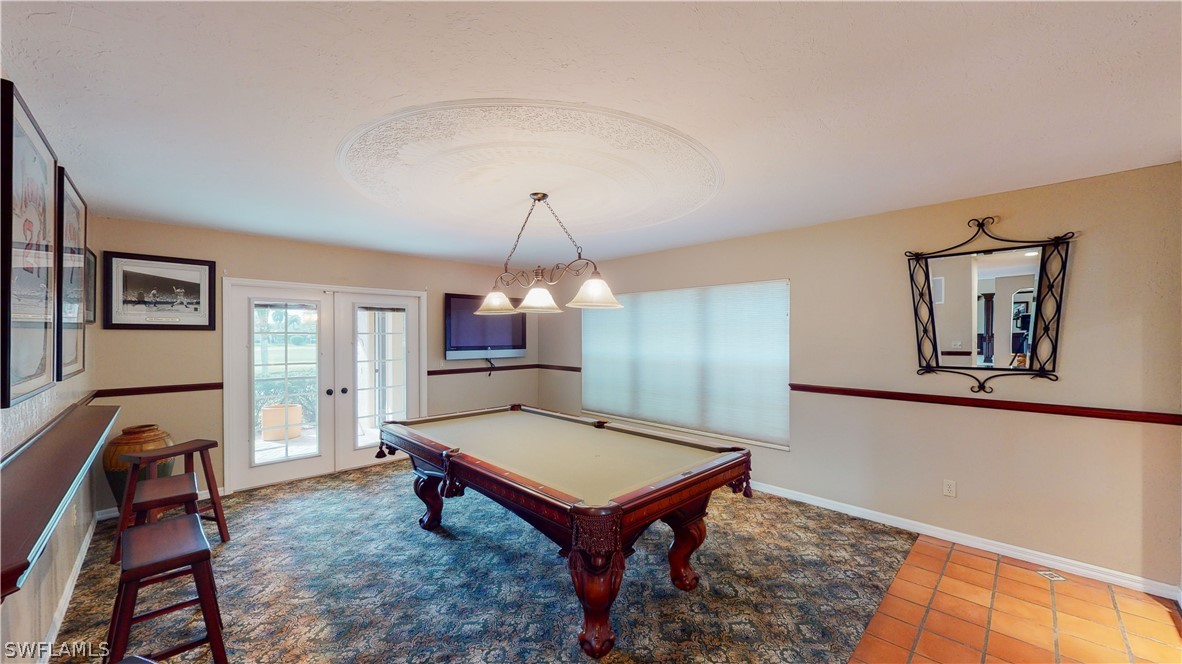 14565 Eagle Ridge Drive Fort Myers, FL 33912 - Photo 17 of 28 a room with pool table and windows