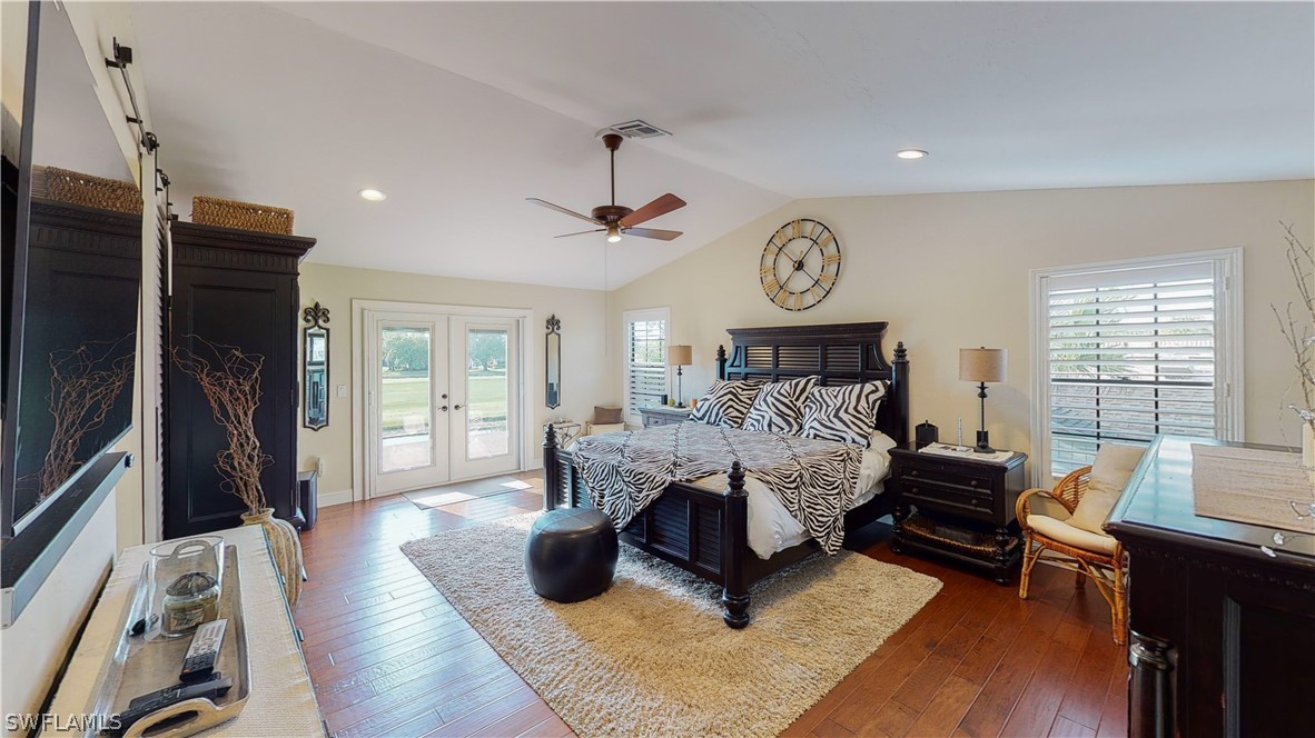 14565 Eagle Ridge Drive Fort Myers, FL 33912 - Photo 18 of 28 a bedroom with furniture and a large window