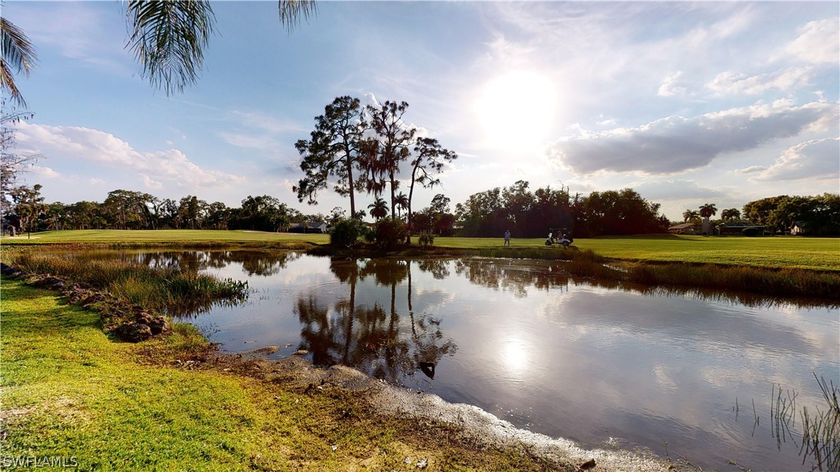 14565 Eagle Ridge Drive Fort Myers, FL 33912 - Photo 2 of 28 a view of a lake with houses in the back