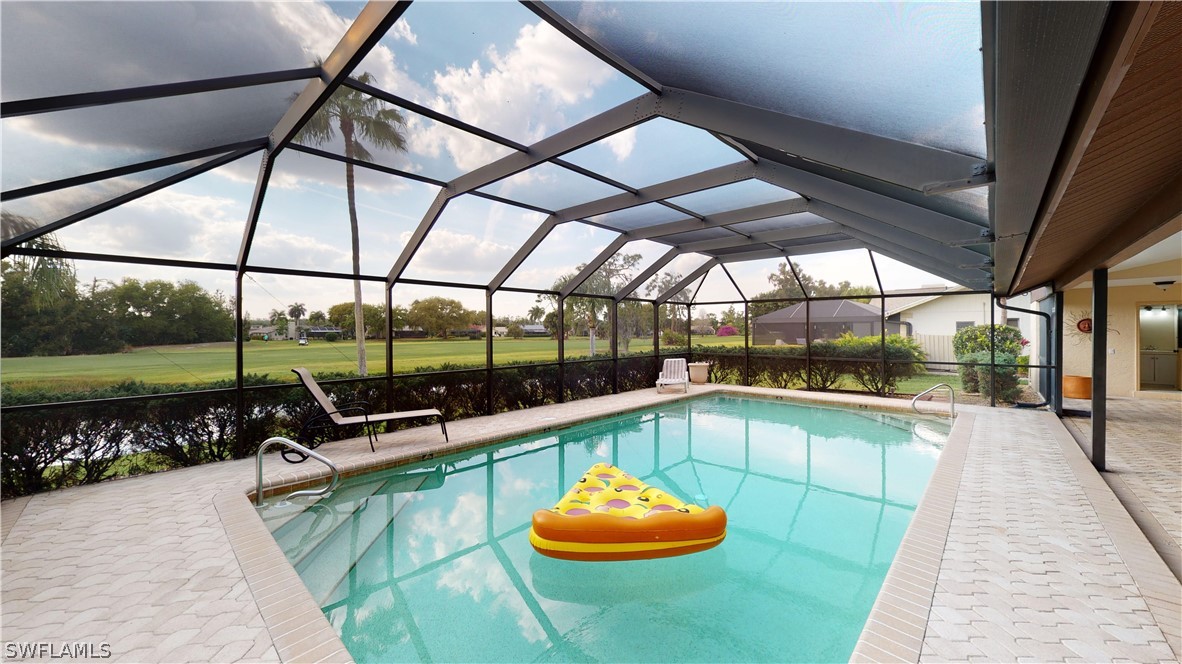 14565 Eagle Ridge Drive Fort Myers, FL 33912 - Photo 3 of 28 a view of a swimming pool with a porch
