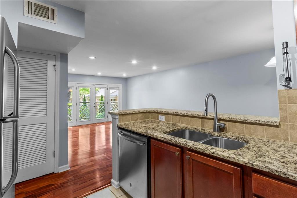 3650 Ashford Dunwoody Road Northeast, Unit 227 Atlanta, GA 30319 - Photo 12 of 23 a kitchen with a sink and large window