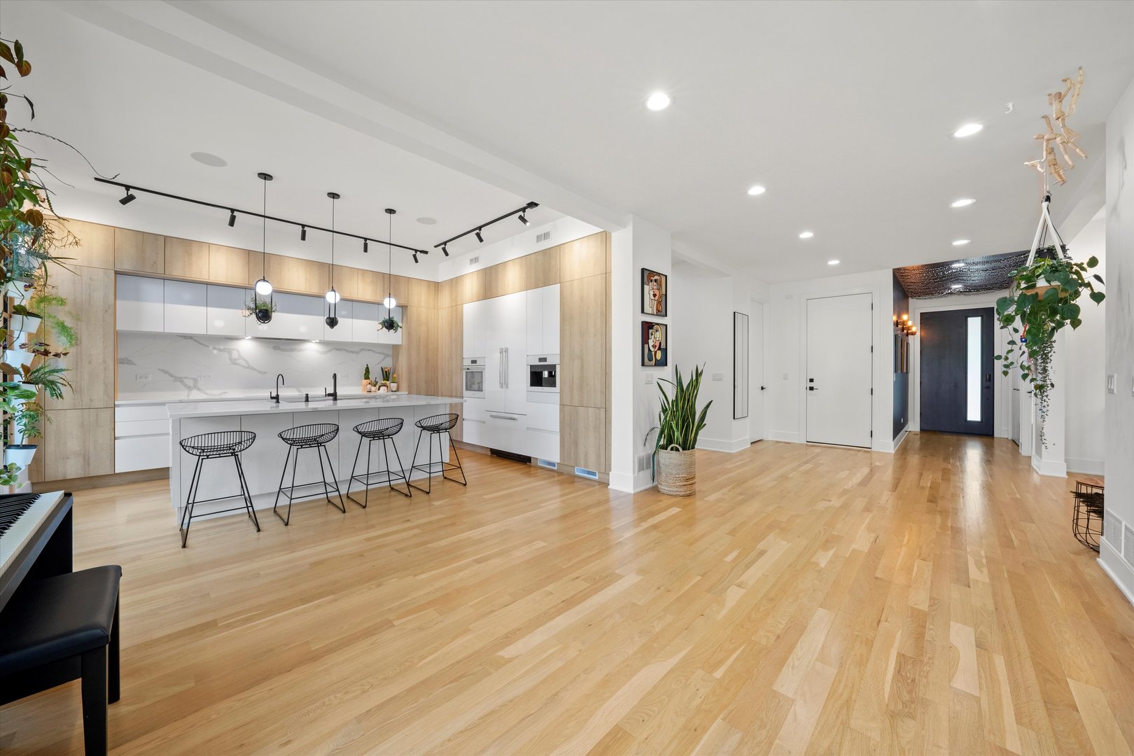 215 Eagle Street Naperville, IL 60540 - Photo 12 of 50 a view of a kitchen with furniture and a refrigerator