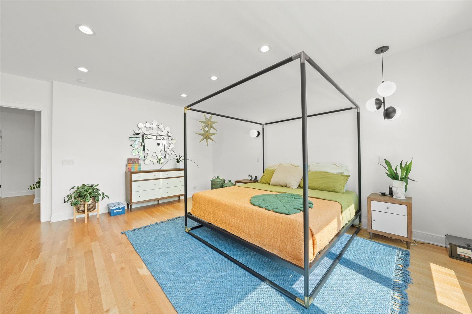 215 Eagle Street Naperville, IL 60540 - Photo 22 of 50 a bedroom with a bed and a potted plant