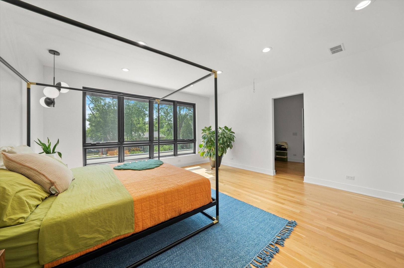 215 Eagle Street Naperville, IL 60540 - Photo 23 of 50 a bed sitting in a spacious bedroom next to a window