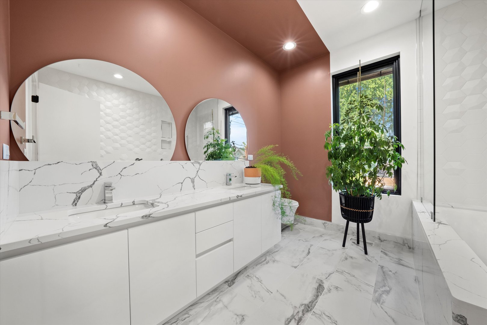 215 Eagle Street Naperville, IL 60540 - Photo 31 of 50 a bathroom with a granite countertop sink a large mirror and a shower