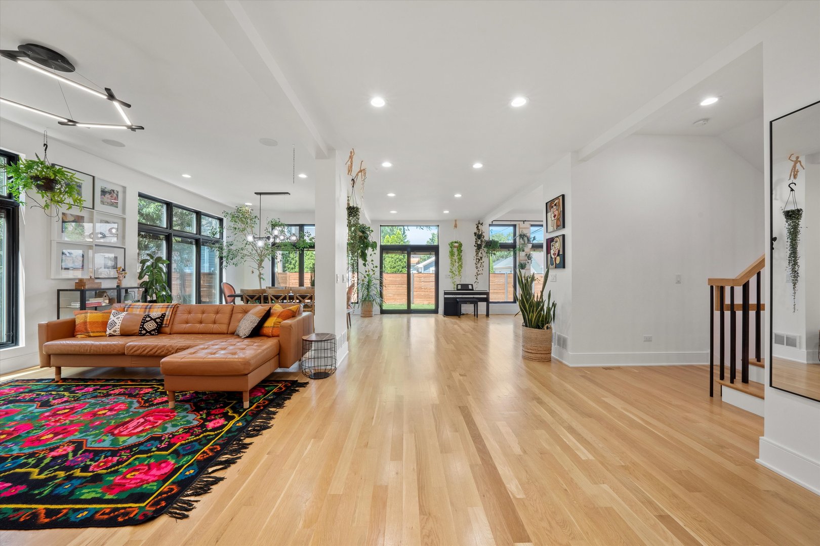 215 Eagle Street Naperville, IL 60540 - Photo 4 of 50 a living room with furniture and a wooden floor