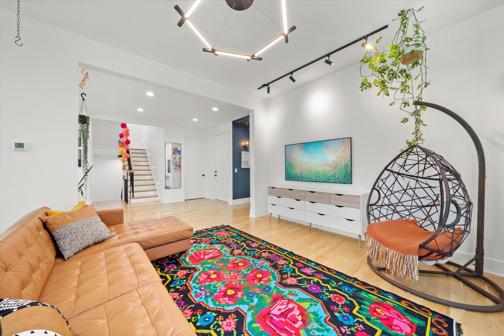 215 Eagle Street Naperville, IL 60540 - Photo 8 of 50 a living room with furniture and a flat screen tv