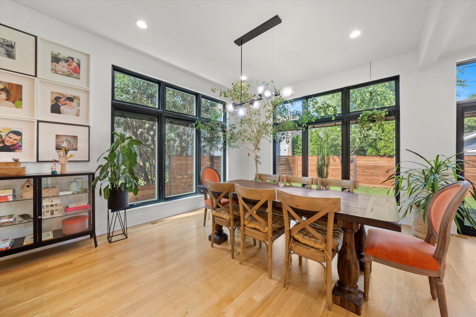 215 Eagle Street Naperville, IL 60540 - Photo 10 of 50 a view of a dining room with furniture large windows and wooden floor