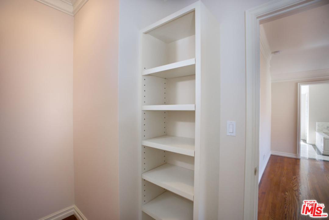 171 South Rodeo Drive Beverly Hills, CA 90212 - Photo 14 of 21 a view of an empty walk in closet