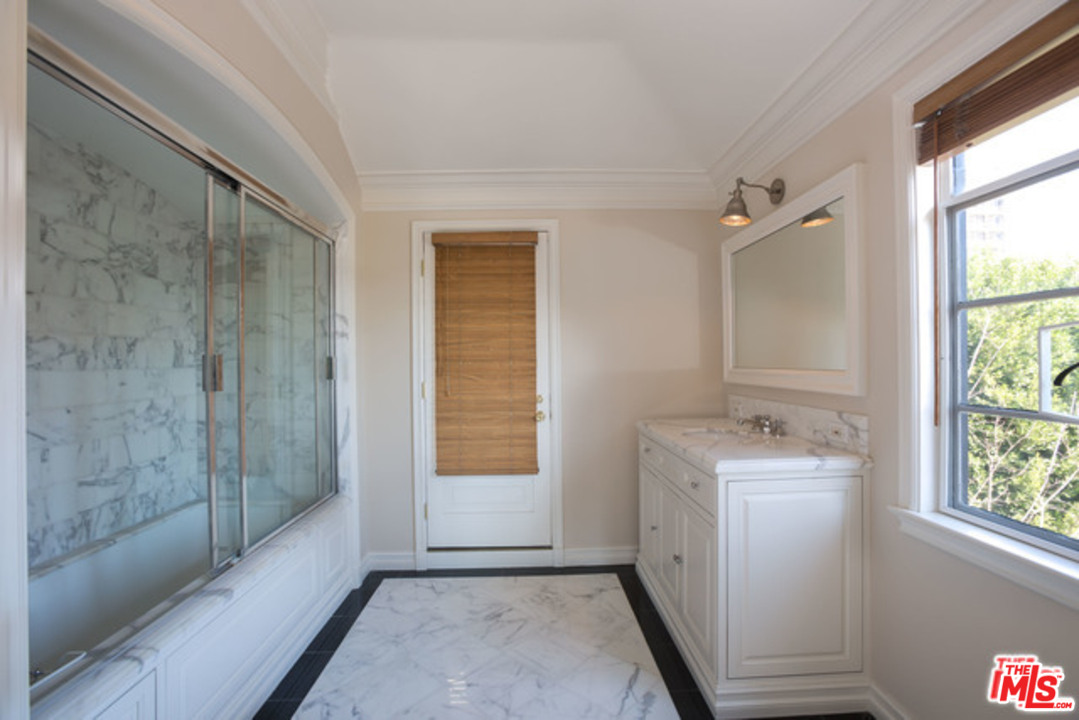 171 South Rodeo Drive Beverly Hills, CA 90212 - Photo 19 of 21 a bathroom with a sink a toilet and shower