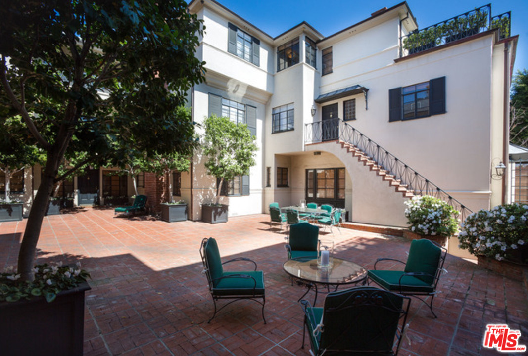 171 South Rodeo Drive Beverly Hills, CA 90212 - Photo 21 of 21 a view of a patio with couches table and chairs and potted plants