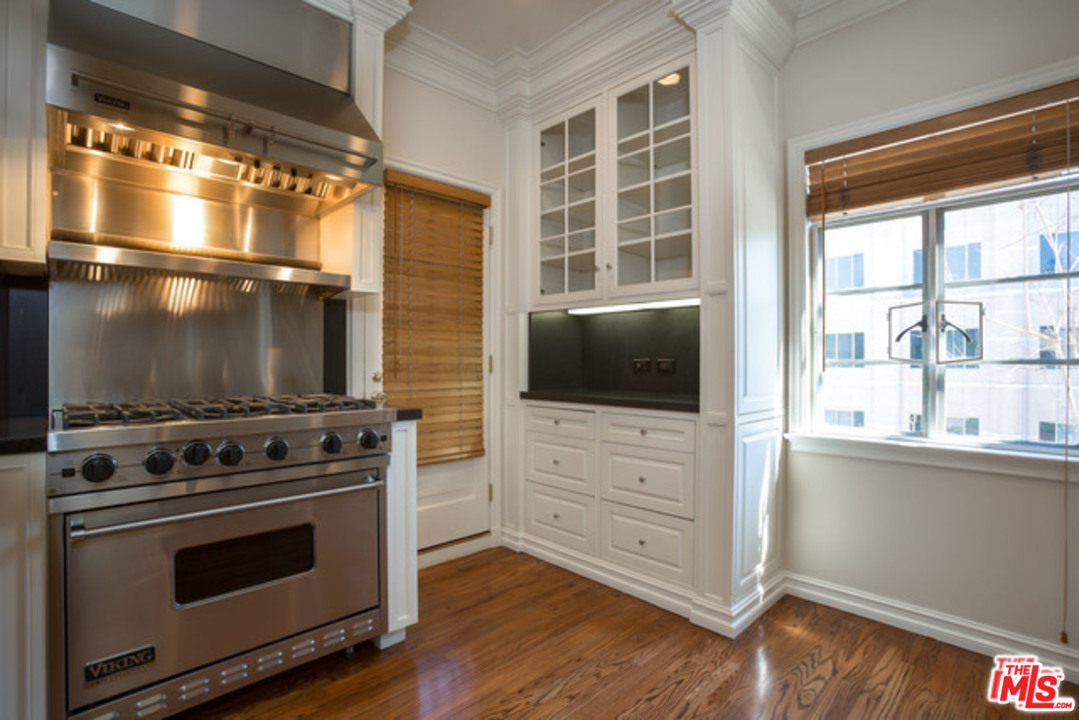 171 South Rodeo Drive Beverly Hills, CA 90212 - Photo 9 of 21 a kitchen with a stove and a microwave
