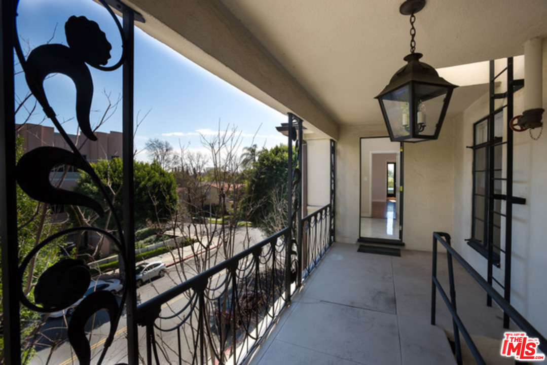 171 South Rodeo Drive Beverly Hills, CA 90212 - Photo 10 of 21 a view of a hallway with wooden floor and a potted plant