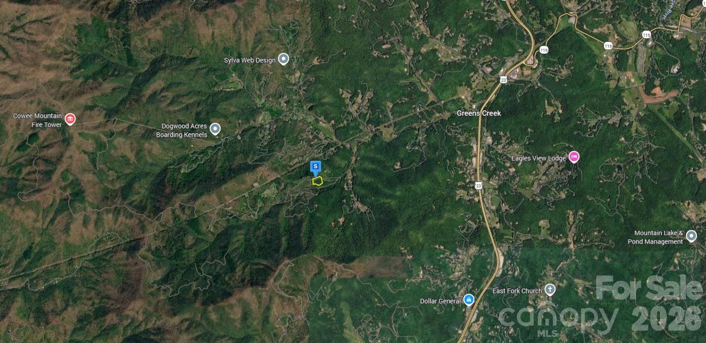 500 Brushy Fork Road Sylva, NC 28779 - Photo 2 of 5 a backyard of a house with lots of green space and trees