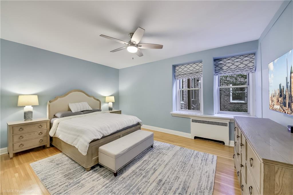 8701 Shore Road, Unit 137 Brooklyn, NY 11209 - Photo 3 of 11 a living room with a bed furniture and a window