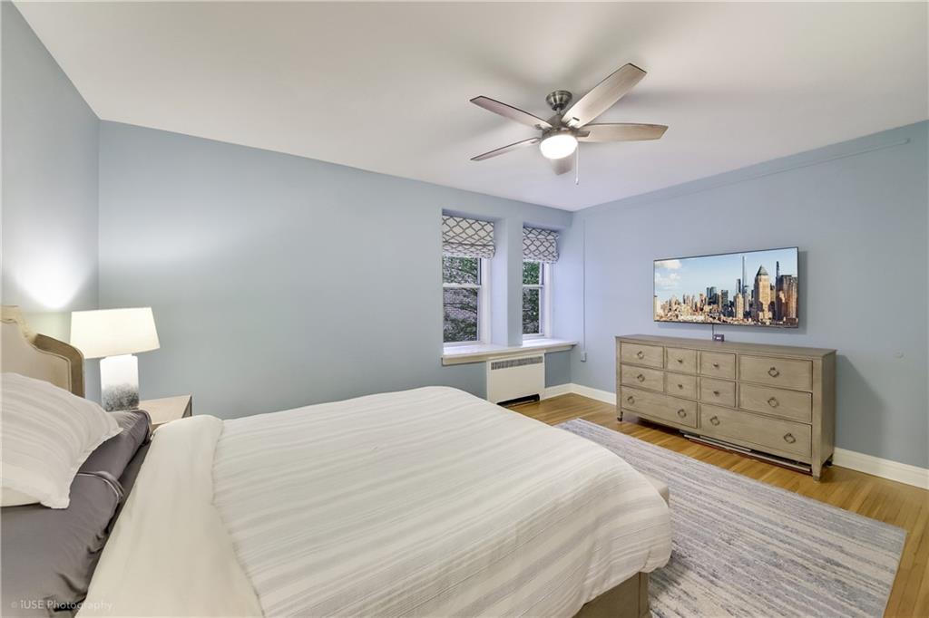 8701 Shore Road, Unit 137 Brooklyn, NY 11209 - Photo 4 of 11 a bedroom with a bed and a dresser