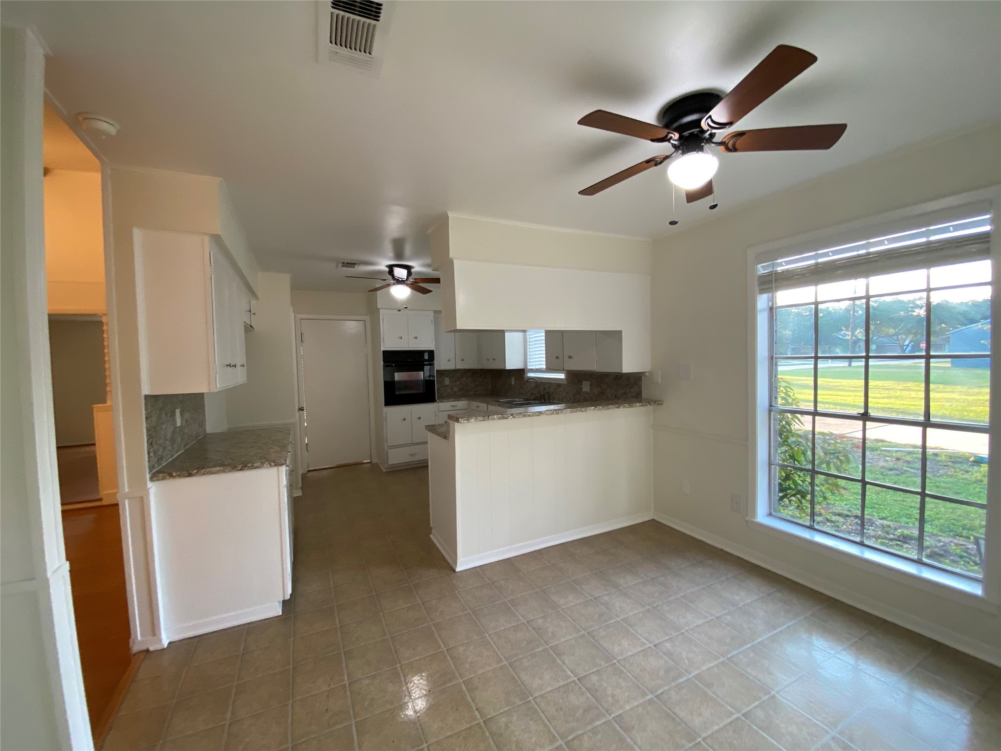 1408 Ward Bend Road Sealy, TX 77474 - Photo 12 of 36 a view of a kitchen with a sink and a window