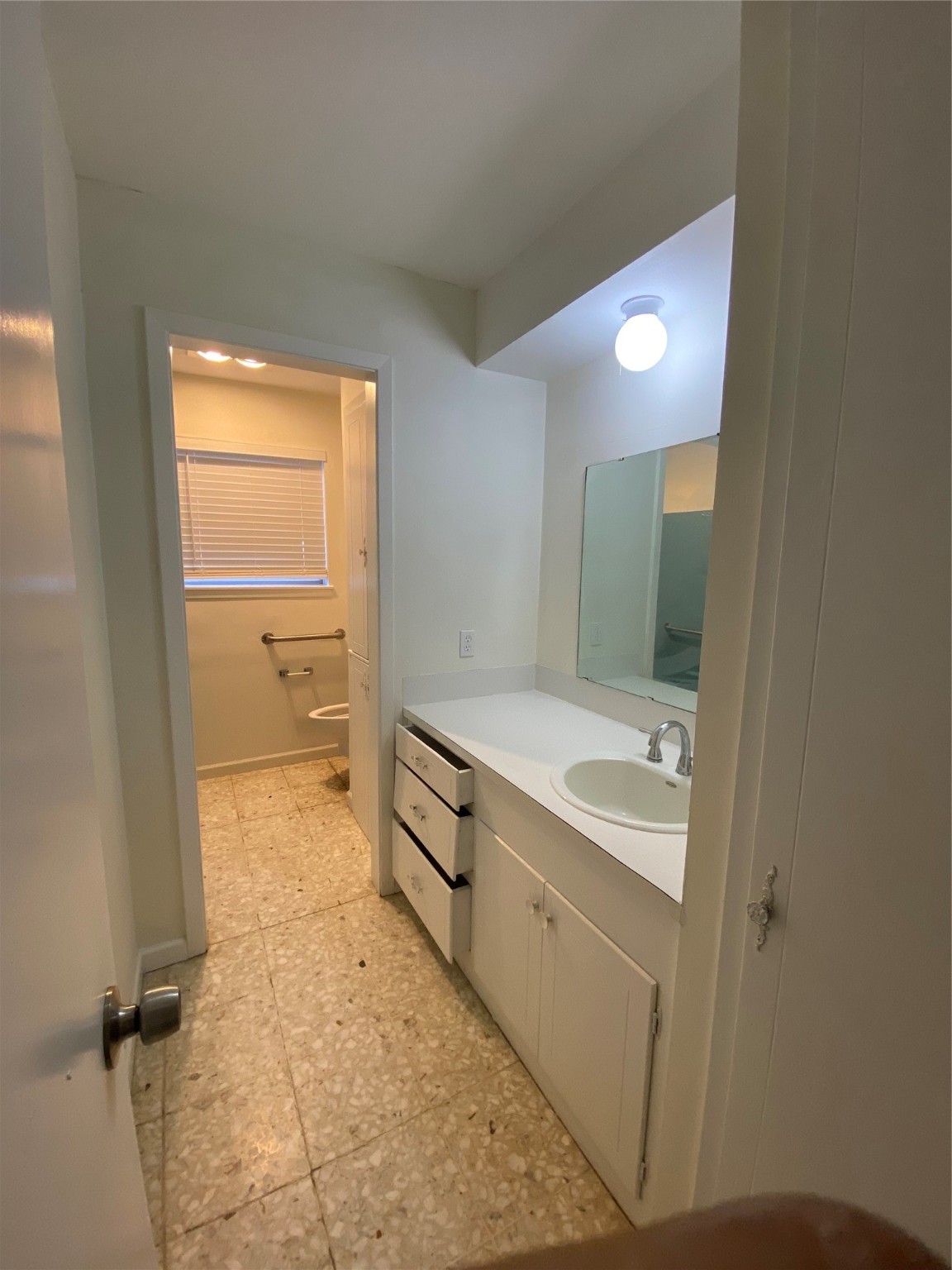 1408 Ward Bend Road Sealy, TX 77474 - Photo 23 of 36 a bathroom with a granite countertop sink a toilet and a mirror