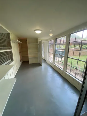 an empty room with windows