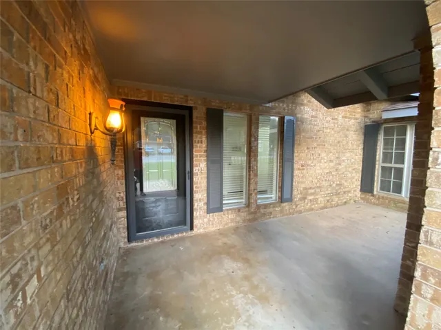 a view of a glass door of the house