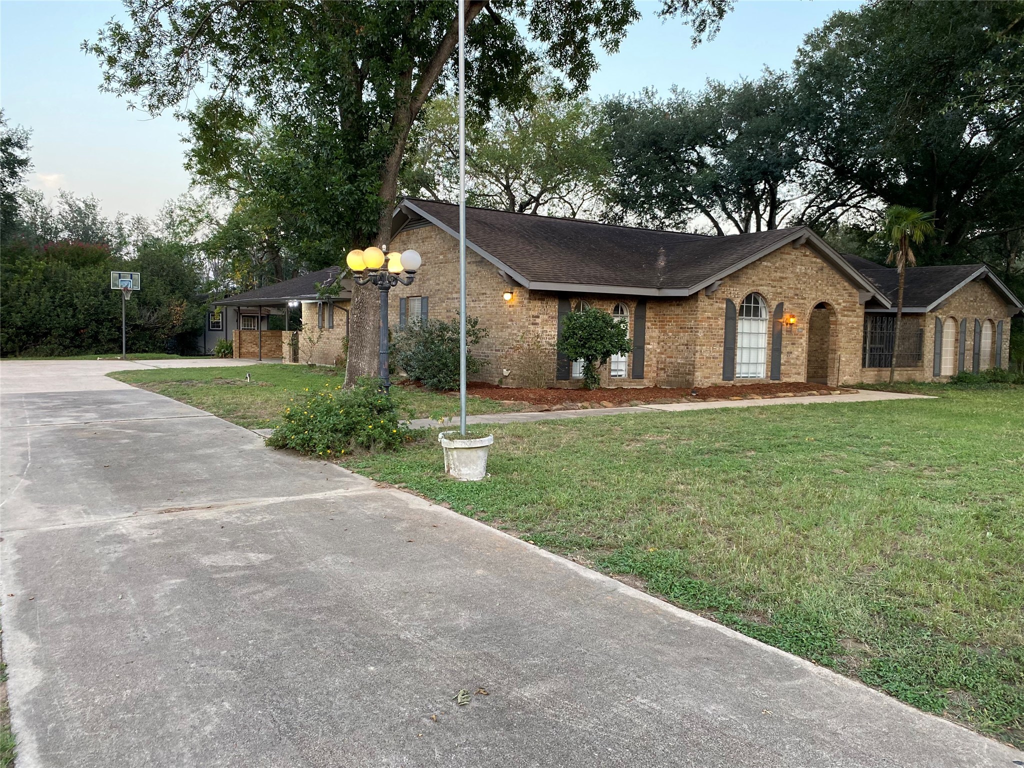 1408 Ward Bend Road Sealy, TX 77474 - Photo 5 of 36 a front view of a house with a yard and trees