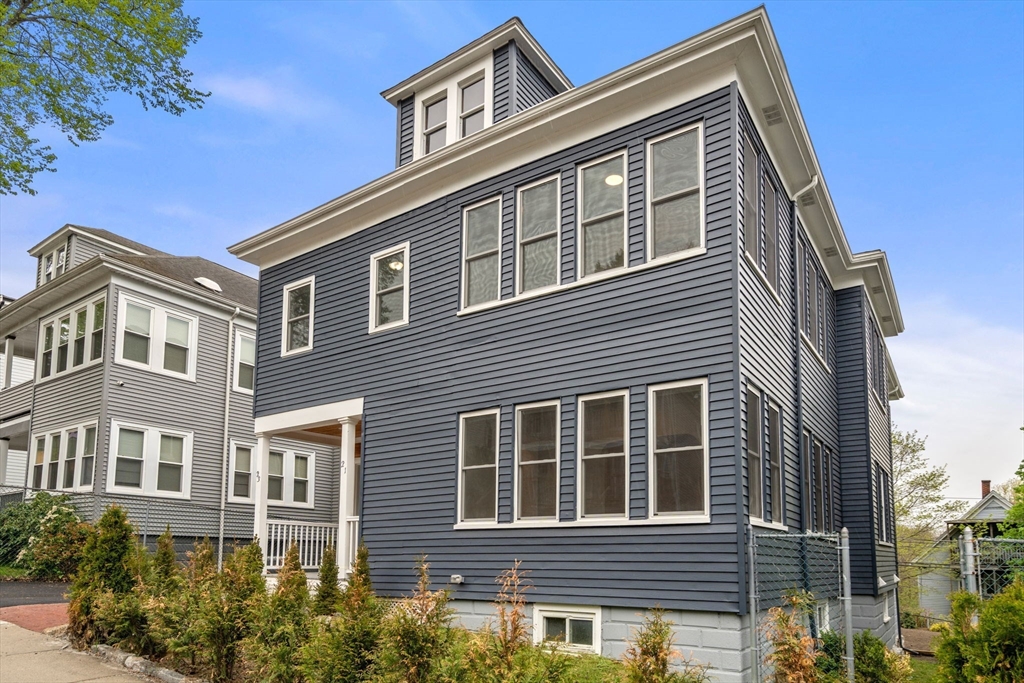 21-23 Westmore Road Boston, MA 02126 - Photo 1 of 42 a front view of a house