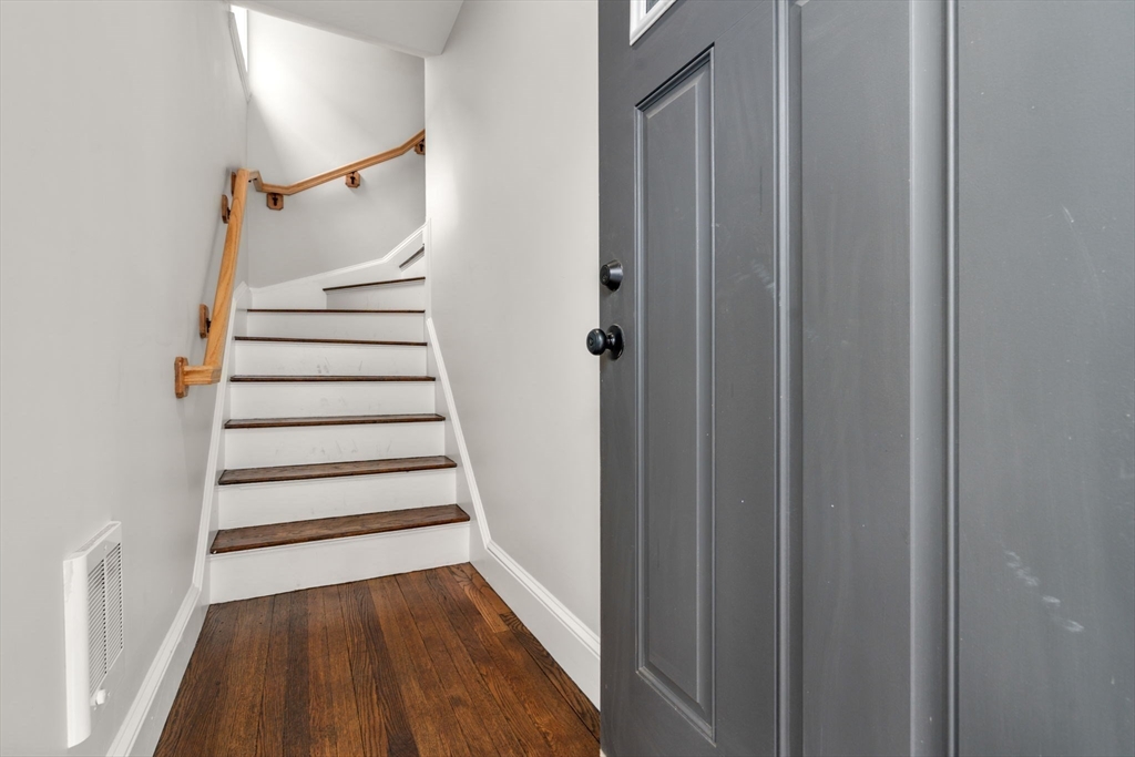 21-23 Westmore Road Boston, MA 02126 - Photo 19 of 42 a view of entryway with wooden floor