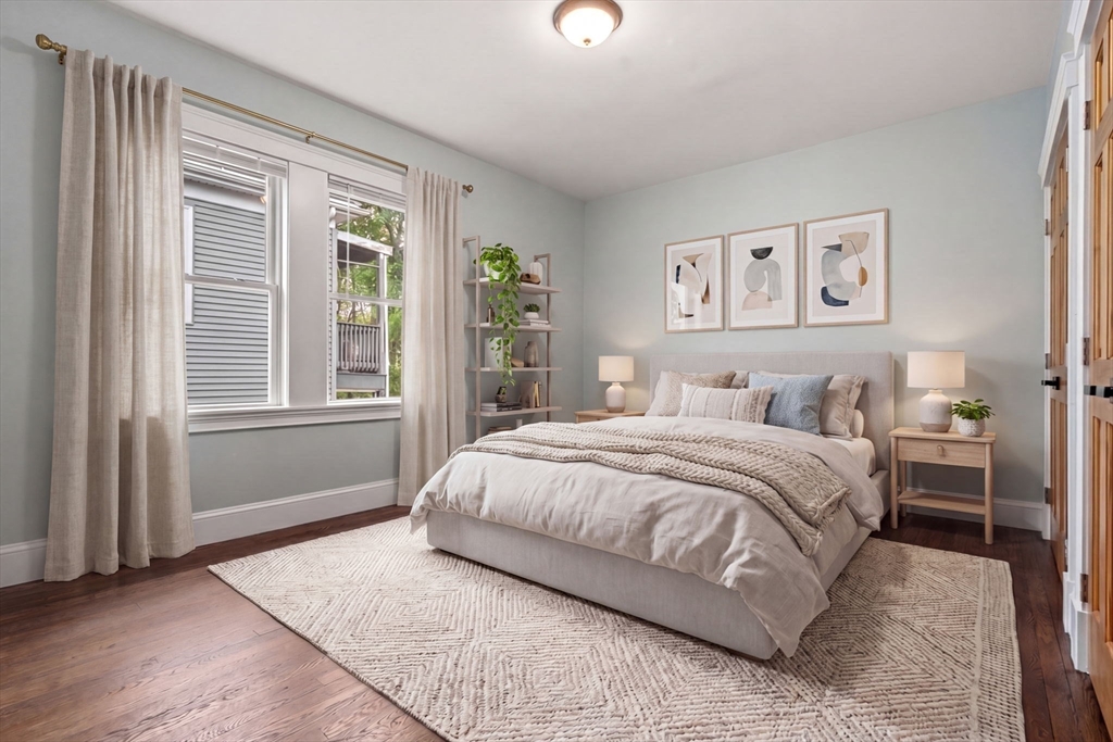 21-23 Westmore Road Boston, MA 02126 - Photo 35 of 42 a spacious bedroom with a large bed and a window