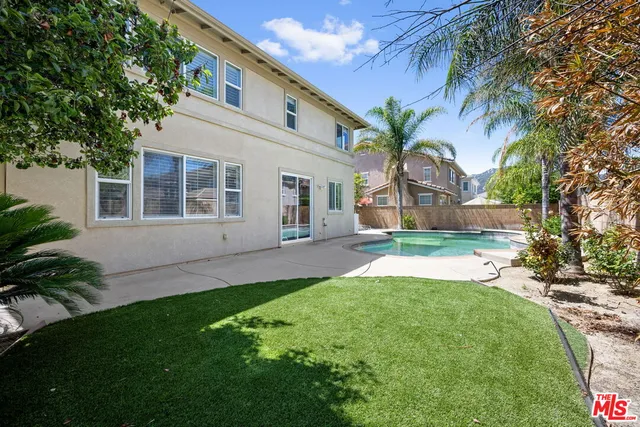 a view of a backyard with a garden and plants