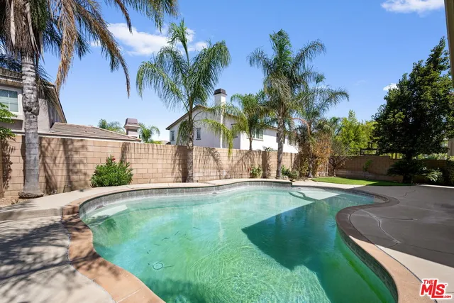 a view of a house with swimming pool