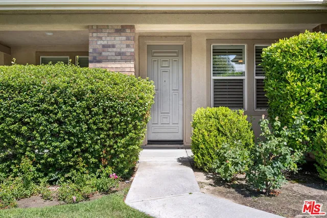 front view of a house with a large window