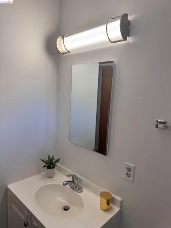 a bathroom with a toilet and a shower curtain