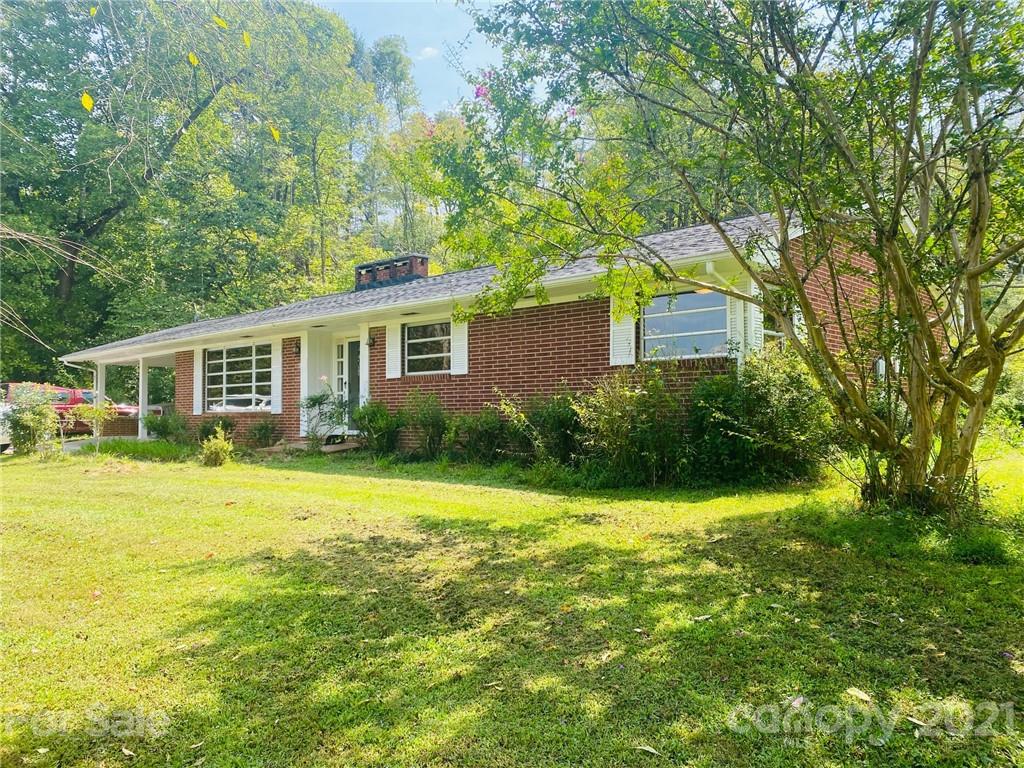 379 South Goforth Road Ferguson, NC 28624 - Photo 1 of 16 a front view of house with yard and green space