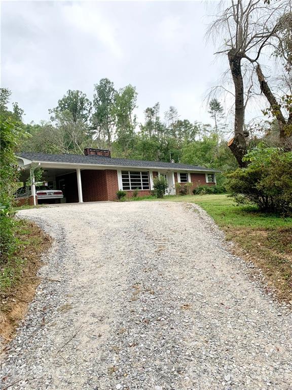 379 South Goforth Road Ferguson, NC 28624 - Photo 16 of 16 a view of a house with a yard