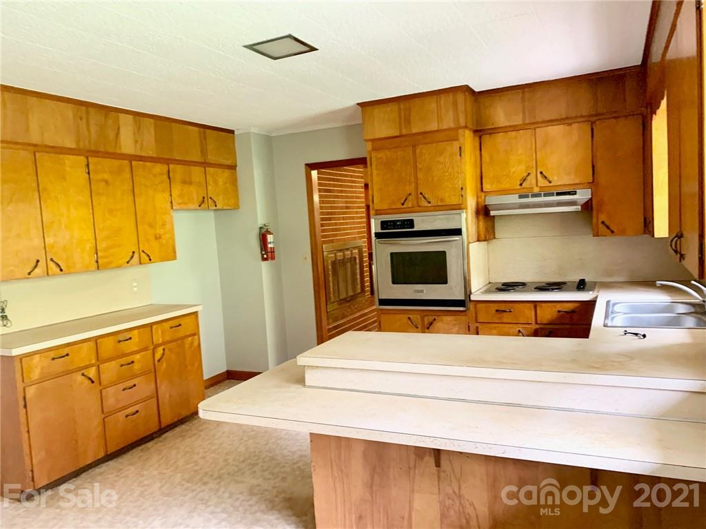 379 South Goforth Road Ferguson, NC 28624 - Photo 8 of 16 a bedroom with a bed and a cabinets